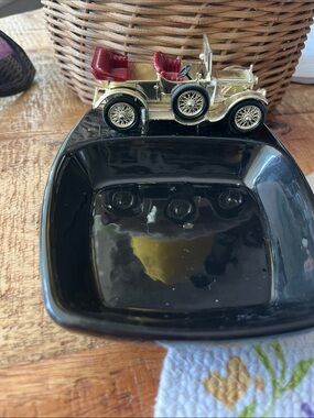 Lesney

 Vintage Gold Toy Car Accent on Black Ceramic ashtray Dish